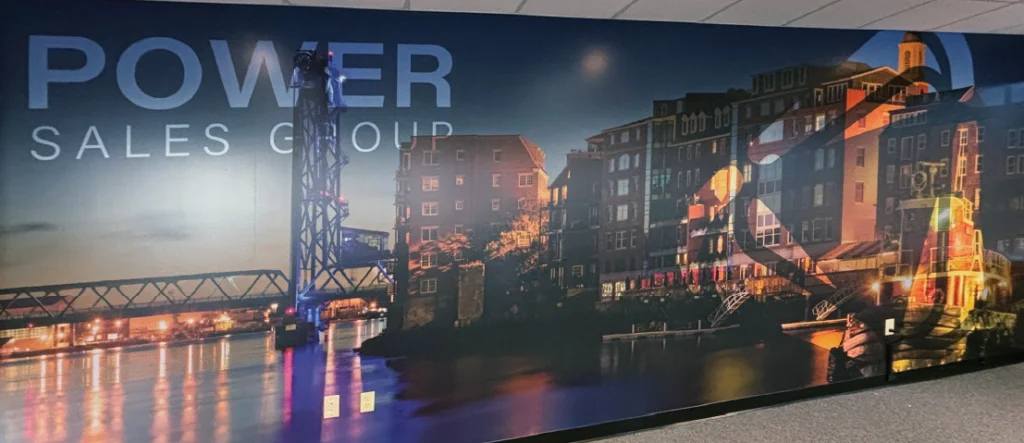 conference room vinyl wall graphic over chairs in reception. features logo and brand overlay on portsmouth nh bridge art